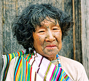 Traditional Dulong Woman with a tattooed face 